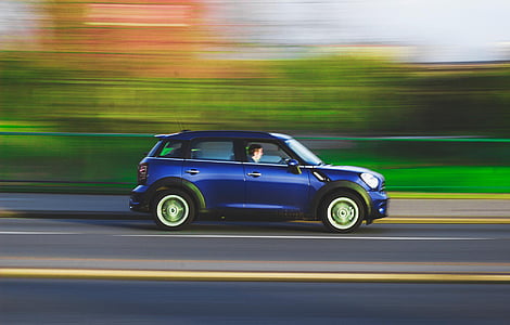 blue SUV running on road thumbnail