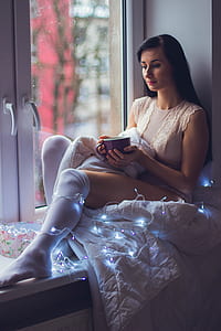 woman in white chemise sitting thumbnail