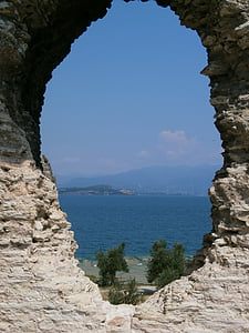 rock with center-hole near water thumbnail