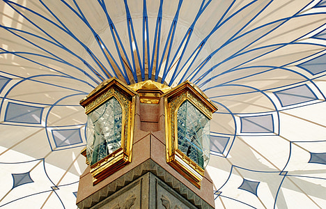low angle photography of brown and brass-colored building thumbnail
