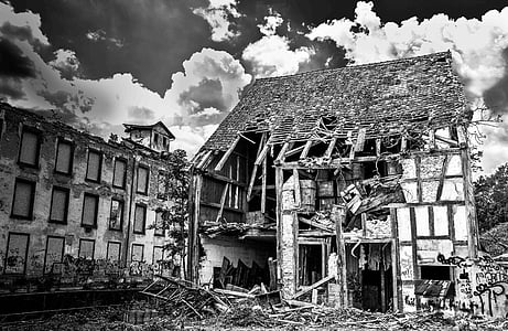 grayscale photography of wrecked house thumbnail