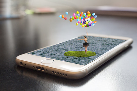 closeup photo of woman holding balloons on iPhone 6 thumbnail