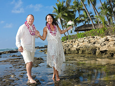 man and woman standing on seashore thumbnail