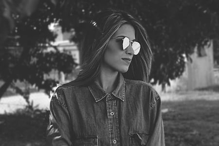greyscale photography of woman wearing sunglasses thumbnail