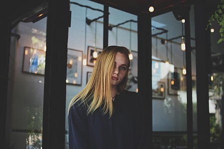 woman standing near glass door thumbnail
