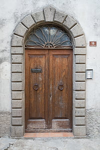 brown wooden closed door near doorbell at daytime thumbnail