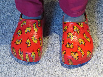 person wearing red rubber sandals thumbnail