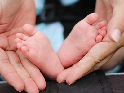 person holding baby's feet thumbnail