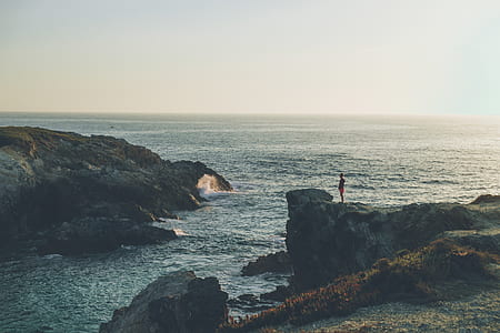 man standing on a cliff thumbnail