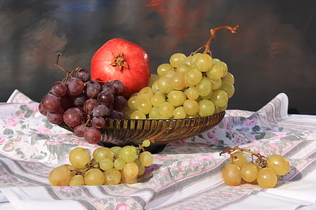 chardonnay and pinot noir with red pomegranate in brown glass bowl closeup photo thumbnail