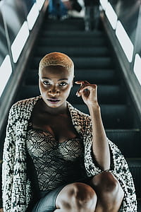 woman sitting on escalator thumbnail