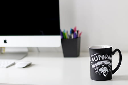 black California printed ceramic mug near iMac thumbnail