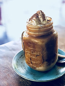 Clear Glass Mason Jar On Blue Saucer thumbnail