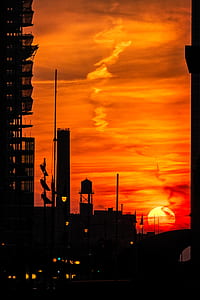 silhouette photography of buildings during sunset thumbnail