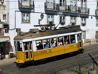 people riding tram during daytime thumbnail