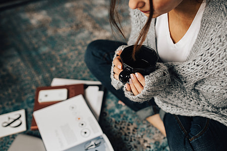 Woman reading magazines on the floor while enjoying her cup of tea thumbnail