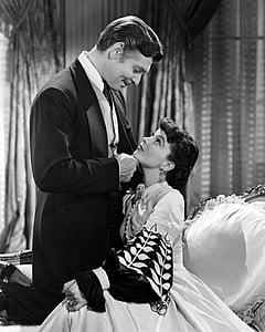 male holding chin of woman near curtain thumbnail