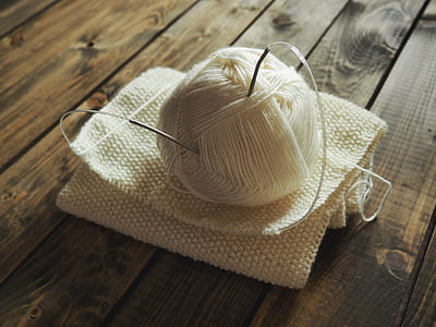 white yarn thread with needles thumbnail