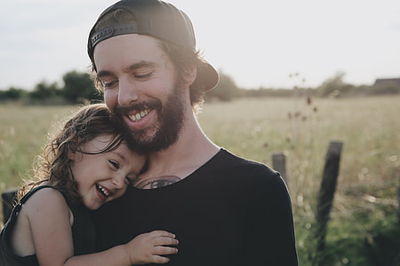 baby girl hugging man thumbnail