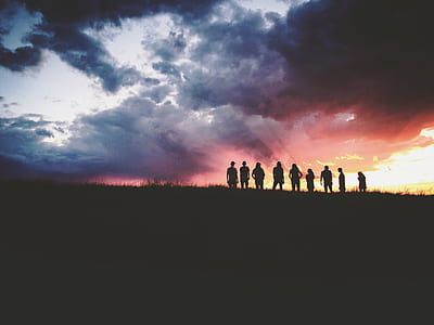 silhouette of people on hill thumbnail