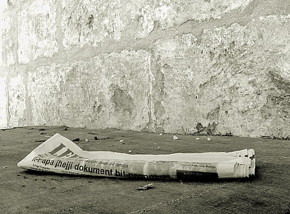 newspaper on gray concrete floor thumbnail