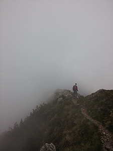 person standing on mountain thumbnail