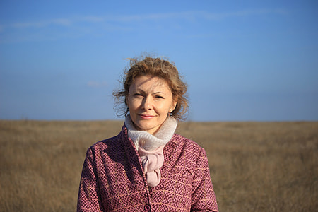 woman standing on open meadow thumbnail