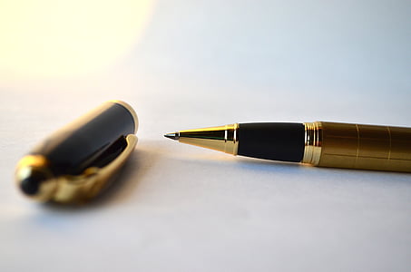 selective focus photography of a pen thumbnail