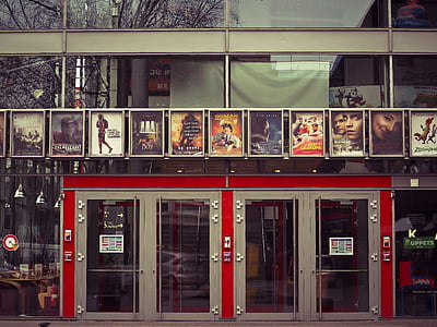 assorted movie posters mountain near glass doors thumbnail