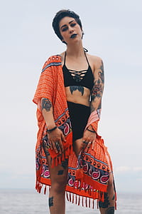 woman with flowers tattoos thumbnail