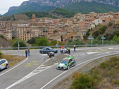 black and green rally car on road at daytime thumbnail