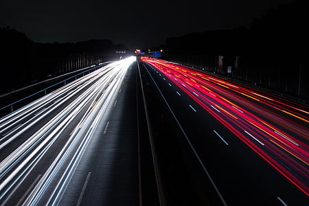 time lapse photography of vehicle passing on road during nighttime thumbnail