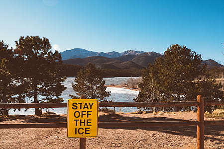 stay off the ice signage on brown wooden railing thumbnail