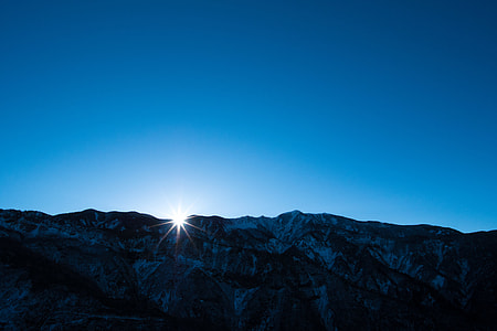 gray mountain under blue sky thumbnail