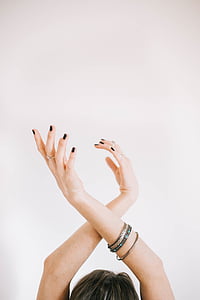 woman crossing her both arms above her head thumbnail