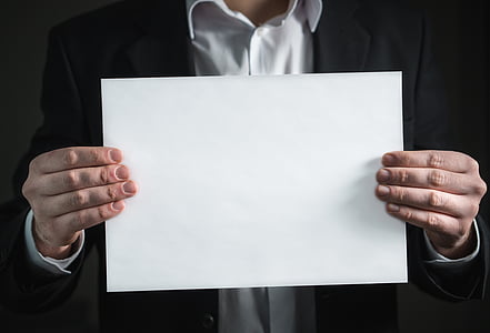 person holding white printing paper thumbnail