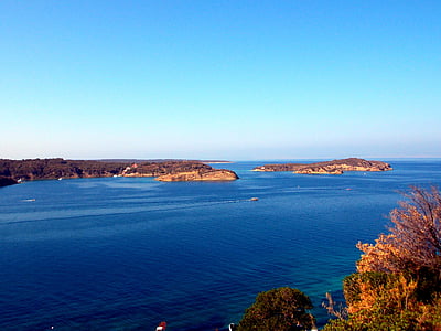 aerial photography of land surrounded with body of water at daytime thumbnail
