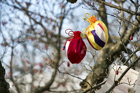 two red and yellow hanging drawstring pouches thumbnail