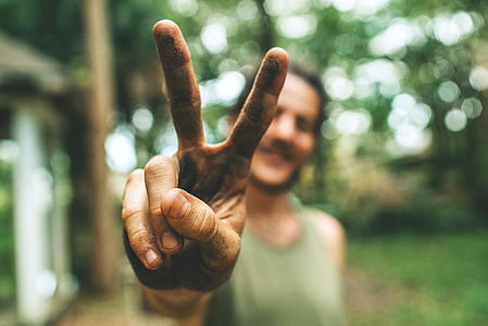 man doing peace hand sign thumbnail