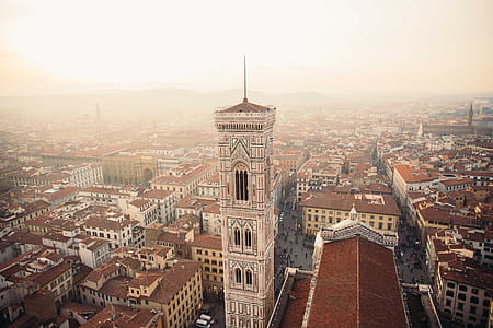 Towers in Florence, Italy surrounded by clay rooftops of residences thumbnail