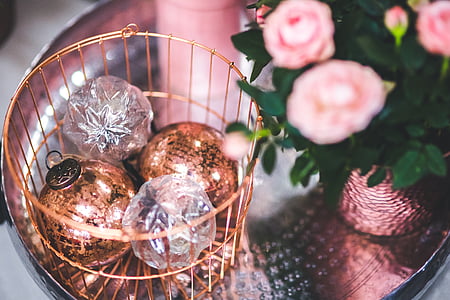 tilt shift lens photography of baubles beside pink flower thumbnail