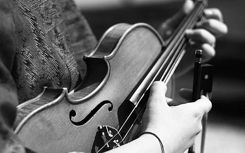 Grayscale Photography of Person Playing Violin thumbnail