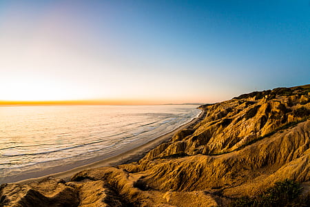 beach near land formation thumbnail