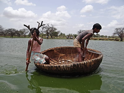 two fishermen sailing on sea thumbnail