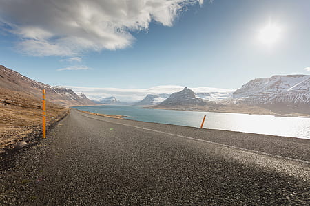 road near body of water thumbnail