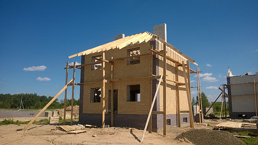 2-storey brown cocnrete building under blue sky during daytime thumbnail