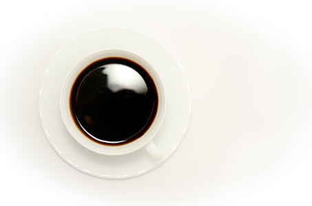 black beverage filled white ceramic cup on top of round white saucer thumbnail