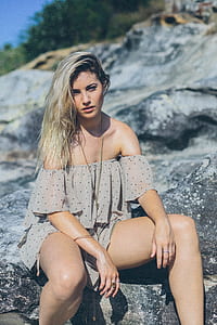 woman sitting on rock thumbnail