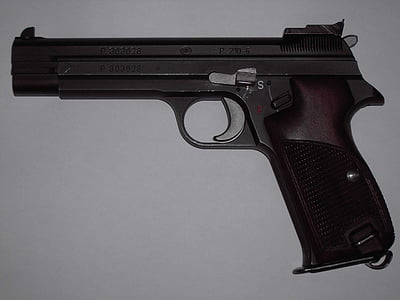 black semi-automatic pistol on white surface thumbnail