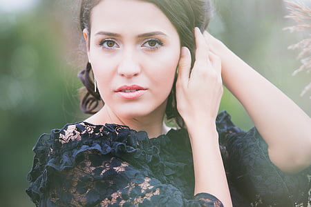 woman wearing black lace top taking photo thumbnail